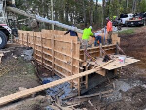 Project will enlarge culvert, widen creek crossing