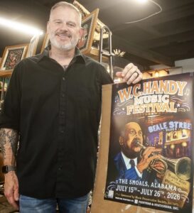 Music helps drive Handy poster artist