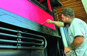 Locomotive gets new paint at Railroad Park